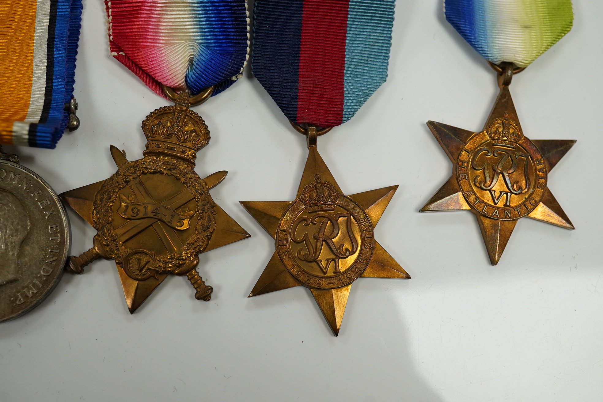 A WWI and WWII medal group awarded to R. Whitham A.B. R.N.; a First World War medal trio with a George V Long Service and Good Conduct Medal, together with a 1939-1945 Medal, the Atlantic Star, and the 1939-1945 Star. Co